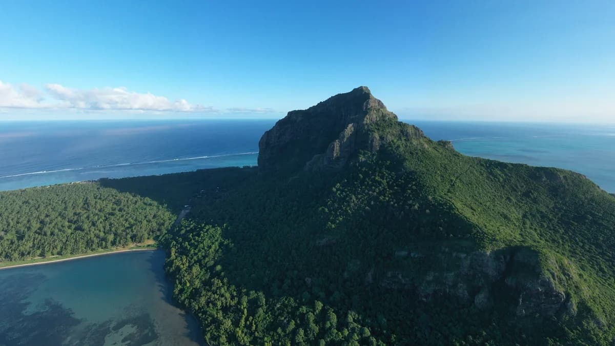 Le Morne Brabant above the forest and blue Indian Ocean